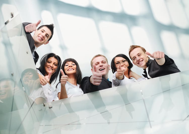 Group of people inside the modern building with thumbs up_seo-opt